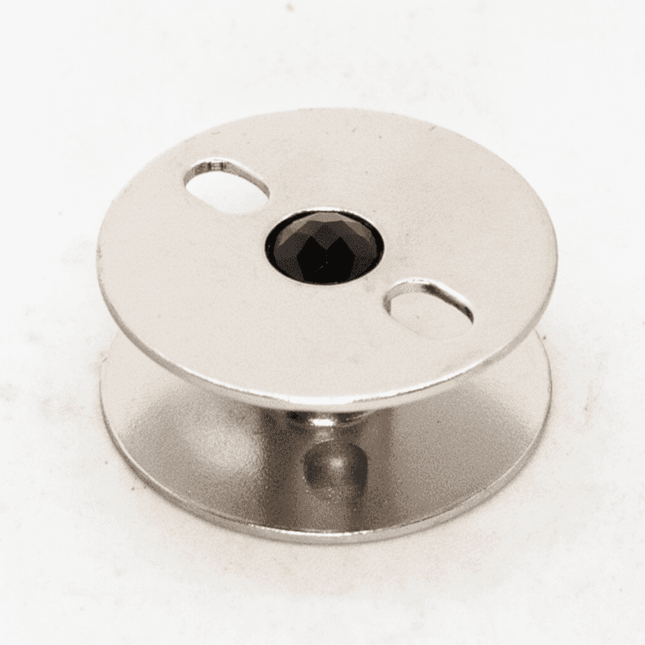 Carrete Máquina Recta Jumbo de metal con eje central reforzado, ideal para costura continua y mayor capacidad de hilo. Compatible con máquinas rectas industriales.