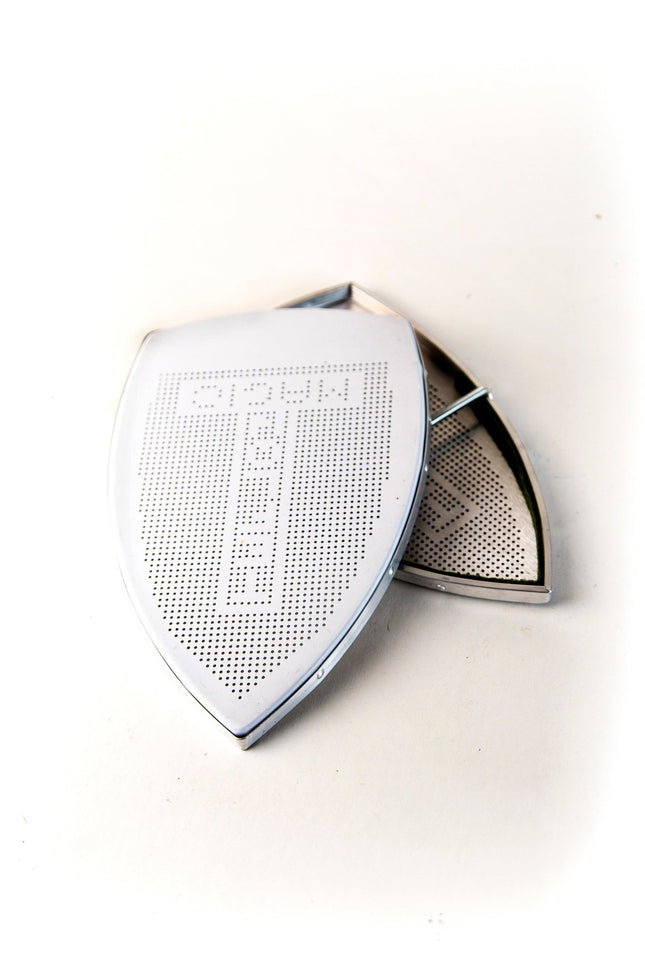 Zapatilla Teflón Plancha - Industrial ES-94AL con superficie perforada para mejor deslizamiento. Accesorio ideal para planchas industriales.